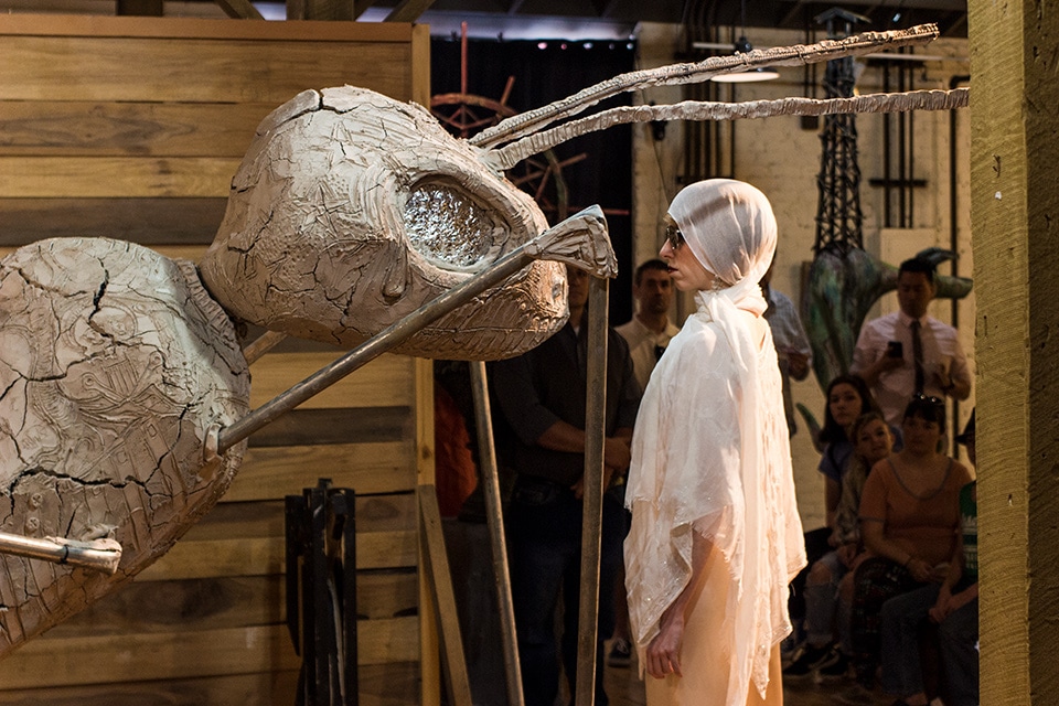 Rebekah Alexander stares at the Bee, a decaying statue installation by Brian Summerville